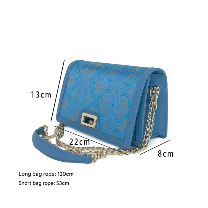 Blue double butterfly patterned handbag with brass chain Blue double butterfly patterned handbag with brass chain